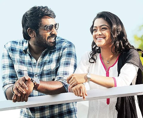 Vijay Sethupathi and Gayathrie in Puriyatha Puthir.