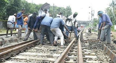 Workers laying tracks near Angamaly railway station    Madhu Krishnan