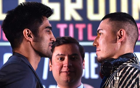 WBO Asia-Pacific Super Middleweight champion Vijender Singh (L) and his competitor WBO Oriental Super Middleweight champion China's Zulpikar Maimaitiali (File | AFP)