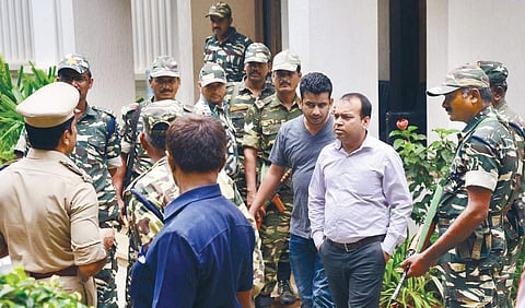 I-T officials and CRPF personnel outside Energy Minister D K Shivakumar’s residence in Sadashivanagar on Friday | Pushkar V