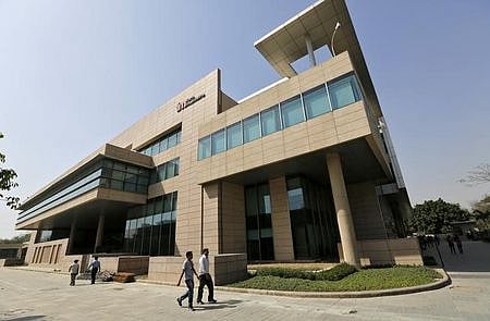 Employees walk inside Tech Mahindra office premises in Noida on the outskirts of New Delhi | File | Reuters