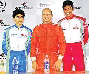 Vikash Anand (left), Sarosh Hataria (centre) & Chittesh Mandody celebrate on the podium