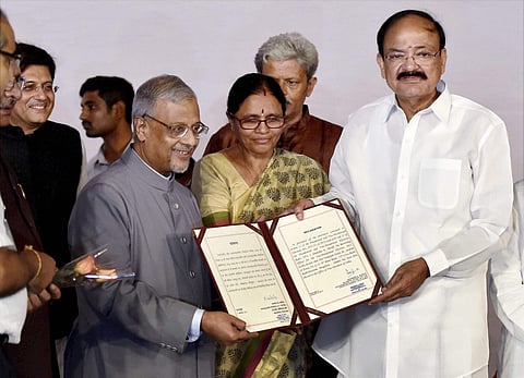 Shumsher Sheriff (L) Rajya Sabha Secretary General and Returning Officer for the election of the Vice-president presents the victory certificate to Venkaiah Naidu after being elected as the Vice President of India in New Delhi on Saturday. | PTI