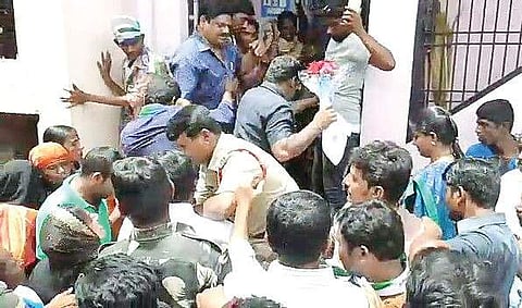 Police try to calm down TDP activists as they surround YSRC leader Roja in Nandyal on Saturday | Express