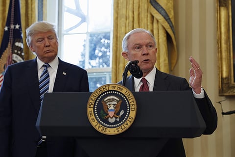 FILE - In this Feb. 9, 2017, file photo, President Donald Trump listens as Attorney General Jeff Sessions speaks in the Oval Office of the White House in Washington, after Vice President Mike Pence administered the oath of office to Sessions. | AP