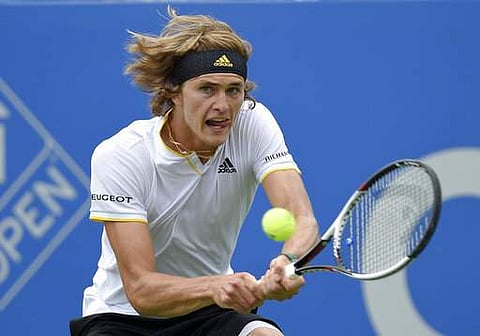 Alexander Zverev, of Germany, returns the ball during the finals of the Citi Open tennis tournament against Kevin Anderson. | AP