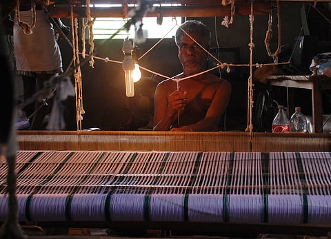 A weaver at work. (File photo | EPS)