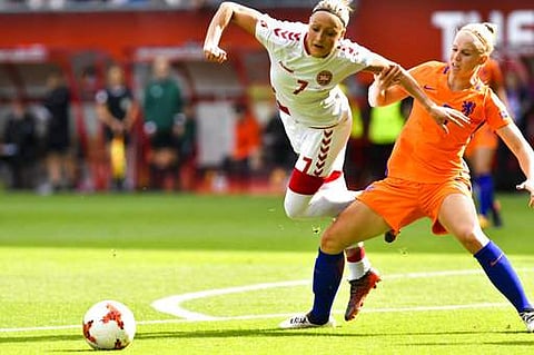 Kika van Es of the Netherlands, right, battles for the ball with Denmark's Sanne Troelsgaard for the ball during the Women's Euro 2017 final soccer match. | AP