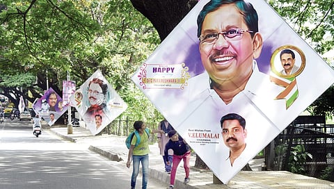 College students duck posters wishing KPCC President G Parameshwara a ‘Happy Birthday’ on Queens Road   Vinod Kumar T