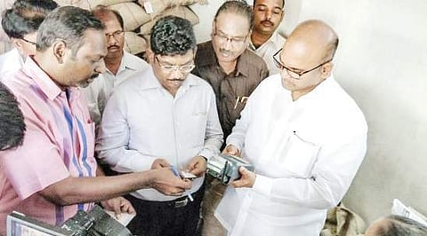 Civil supplies minister Prathipati Pulla Rao inspecting a fair price shop in Vijayawada on Monday | Express