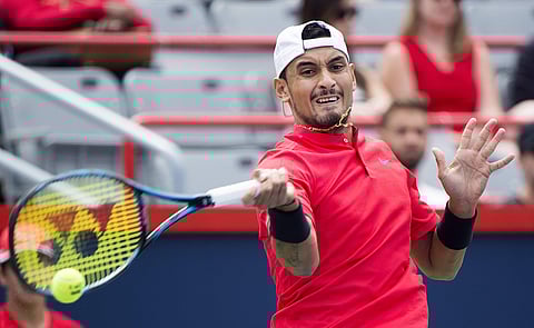 Nick Kyrgios, of Australia, returns to Viktor Troicki, of Serbia, during a first round match at the Rogers Cup tennis tournament in Montreal. | AP