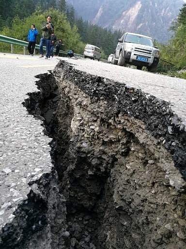 A crack, caused by an earthquake on a road is seen in picture. (AFP)