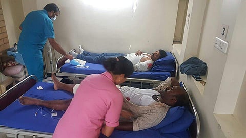 The injured policemen getting treatment at Sarjapur, Bengaluru. (Express Photo | Nagesh Polali)