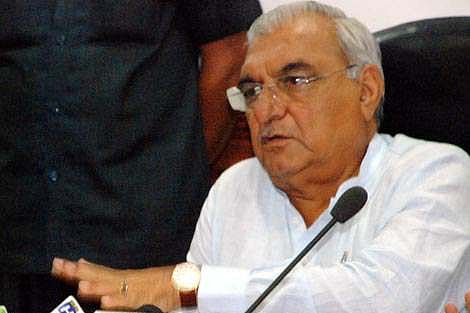 Former chief minister Bhupinder Singh Hooda gestures during a meeting. (PTI)
