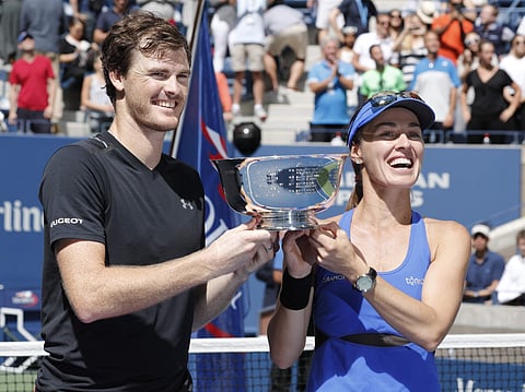 Martina Hingis, of Switzerland, right, and Jamie Murray, of Great Britain, hold up the championship trophy after winning the mixed doubles final of the US Open title. | AP