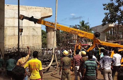 Cranes engaged in removing the debris at Rasulgarh flyover in Bhubaneswar. (Siba Mohanty | ENS)