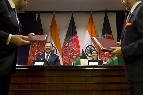 Afghanistan Foreign Minister Salahuddin Rabbani, sitting left and Indian External Affairs Minister Sushma Swaraj, sitting right, applaud during the exchange of agreements in New Delhi, India (AP)