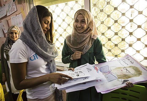 Priyanka Chopra, a UNICEF Goodwill Ambassador, views artwork by Eman Ahmad, right, from Aleppo, at UNICEF's Makani Center in Amman, Jordan, Sunday, Sep. 10, 2017. (Photo | Associated Press)