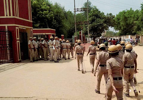 Police personnel maintain security at the Ryan International School in the view of protests in Gurugram on Sunday. | PTI