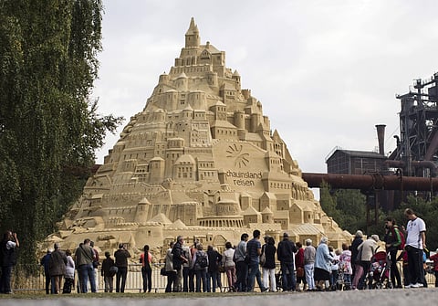 isitors surround a sandcastle at the Landschaftspark in Duisburg, Germany (AP)