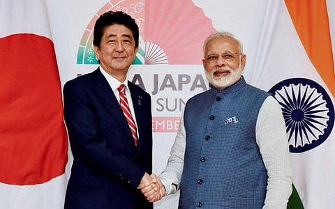 Prime Minister Narendra Modi with his Japanese counterpart Shinzo Abe ahead of India- Japan annual summit at Mahatma Mandir in Gandhinagar on Thursday. (PTI)