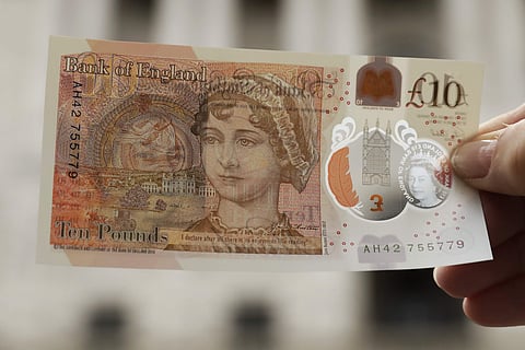 One of the new British 10 pound notes is posed for photographs outside the Bank of England in the City of London. (Photo | AP)