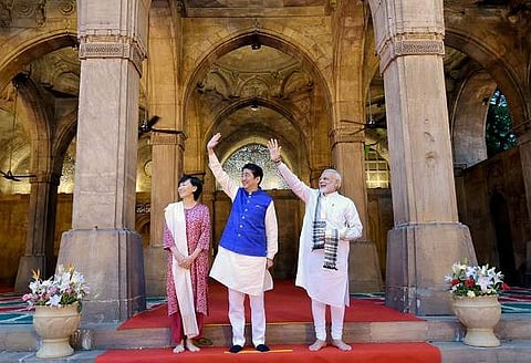 Prime Minister Narendra Modi and Japanese Prime Minister Shinzo Abe wave during a visit to the Sidi Saiyyed Mosque in Ahmedabad. (Photo | PTI)