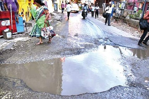 A huge pothole opposite Movieland theatre on SC Road, Gandhinagar, in Bengaluru on Thursday | Nagaraja Gadekal