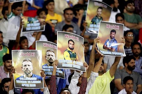 Pakistan cricket fans praise World XI players during the second Twenty20 match at the Gaddafi Cricket Stadium in Lahore, Pakistan, Wednesday, Sept. 13, 2017. | AP