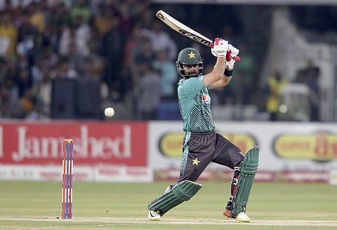 Pakistan's Ahmed Shahzad hits boundary against World XI at Gaddafi stadium in Lahore, Pakistan on Sept. 15, 2017. (Photo | AP)