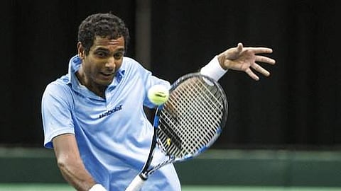 India's Ramkumar Ramanathan returns to Canada's Brayden Schnur during a Davis Cup tennis match in Edmonton, Alberta. 