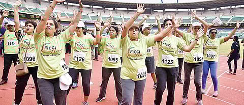 Participants warm up before the run  P Jawahar