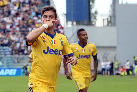 Juventus' Paulo Dybala celebrates after scoring during a Serie A soccer match between Sassuolo and Juventus, at Mapei Stadium in Reggio Emilia, Italy, Sept. 17, 2017. | AP