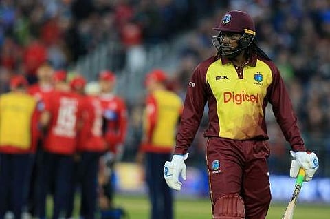 West Indies' Chris Gayle walks back to the pavilion after losing his wicket during the T20 International cricket match between England and West Indies at The Emirates Riverside, Chester-le-Street in north east England on September 16, 2017. | AFP