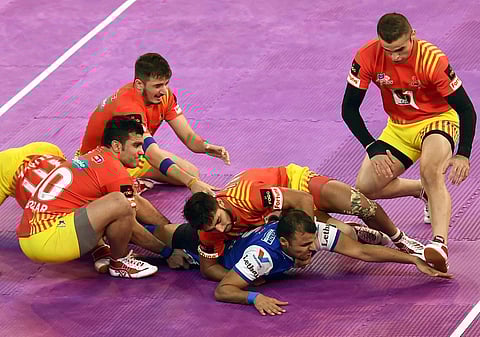 Gujarat Fortune Giants orange jersey and Haryana Steelers Blue Jersey in action during Pro Kabaddi league match in Kolkata on Saturday.|PTI