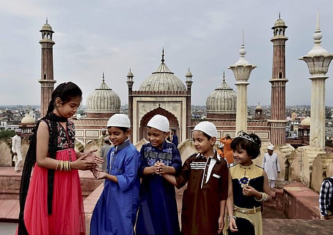 Eid ul-Adha is celebrated to  honour the willingness of Ibrahim to sacrifice his son to show submission to Allah’s command. In picture: New Delhi Muslim children pose after Eid al-Adha prayers at Delhi's Jama Masjid on Saturday. (Photo | PTI)
