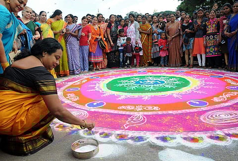Mysuru Dasara also called Navratri is celebrated over a period of 10 days in Karnataka. This year the festival falls on 21st-30th September. In picture,  Karnataka Minister for Women and Child Welfare Umashree inaugurates a rangoli competition organized as part of Dasara in front of Kote Anjaneya Swamy temple in Mysuru. (EPS | S Udayashankar)