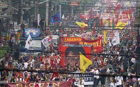Hundreds of protesters march towards  Manila park for a huge rally to call for an end to the killings in the so-called war on drugs of President Rodrigo Duterte and his alleged 'tyrannical rule' . (Photo | AP)
