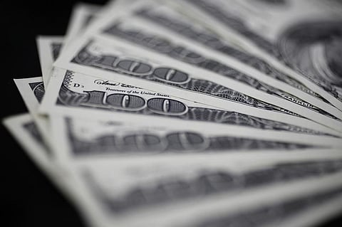 A picture illustration shows U.S. 100 dollar bank notes taken in Tokyo. (File photo |  Reuters)
