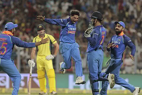 India's Kuldeep Yadav celebrates after taking his third wicket in an over during the second one-day international cricket match against Australia at Eden Gardens in Kolkata, India, Thursday, Sept. 21, 2017. | AP