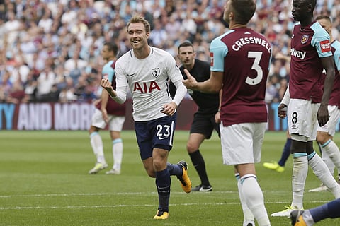 Tottenham's Christian Eriksen celebrates after scoring against West Ham (AP)