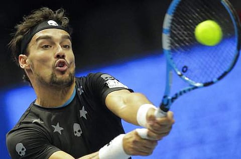 Fabio Fognini of Italy returns the ball to Roberto Bautista of Spain during the St. Petersburg Open ATP tennis tournament semi-final match in St.Petersburg. | AP
