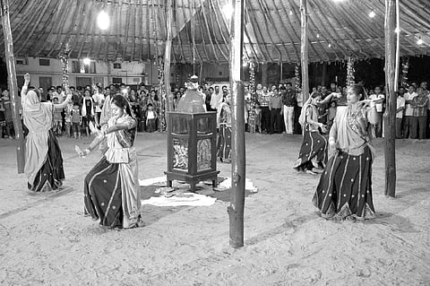 Dressed in traditional attires, devotees perform Garba in Rourkela on Saturday | Express