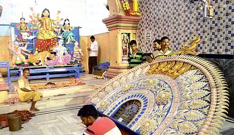 The gold and silver backdrop of Goddess Durga at Choudhury Bazaar pandal in Cuttack | Express