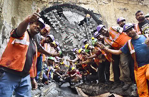 Workers celebrate quick completion of the metro rail tunnel work. (Express Photo Service | Ashwin Prasath)