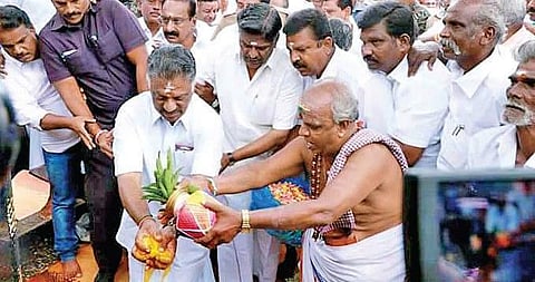 (L) Deputy CM O Panneerselvam during a puja to mark the release of water from Mullaiperiyar dam at Thekkady in Kerala on Monday; and a dam sluice | Express