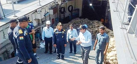 District Collector Kartikeya Mishra with the crew members aboard INS Gharial in Kakinada Port on Monday | Express