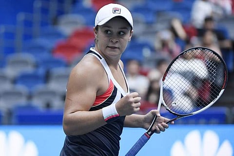 Ashleigh Barty celebrates her victory over Karolina Pliskova in their women's singles quarter-final match at the WTA Wuhan Open. | AFP