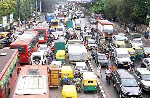 Vehicles stuck in a traffic jam or moving at a snail’s pace is a common sight near Silk Board junction