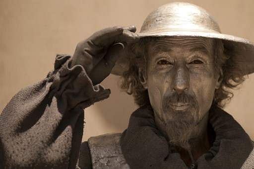 “Virtue is persecuted by the wicked more than it is loved by the good.”  In pic:  A street artist dressed with a costume of Don Quixote performs in Malaga, Spain on June 17, 2013. (Photo | AFP)